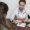 doctor-explaining-anatomic-model-patient-high-angle (1)